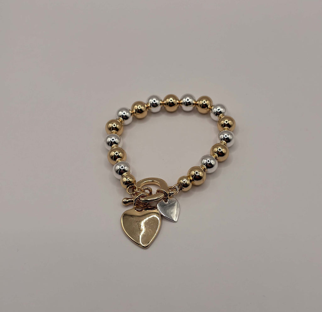 Elastische statement armband hart goud- en zilverkleurig