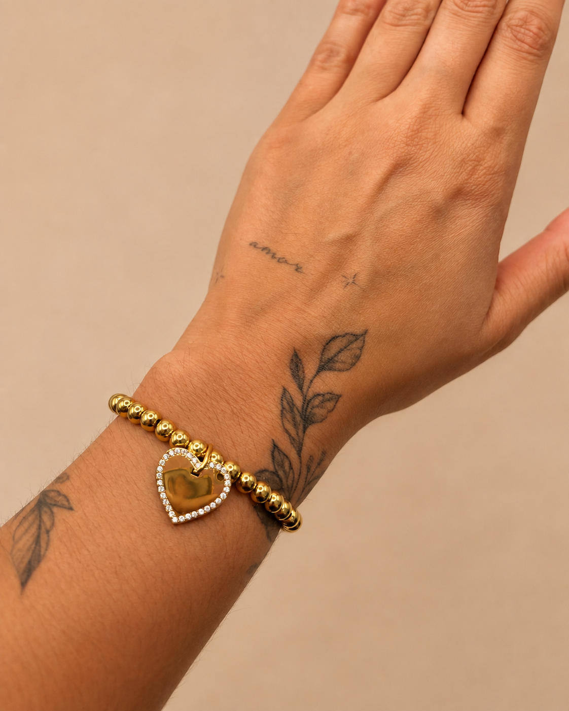 Armbandje met hartje en steentjes goud