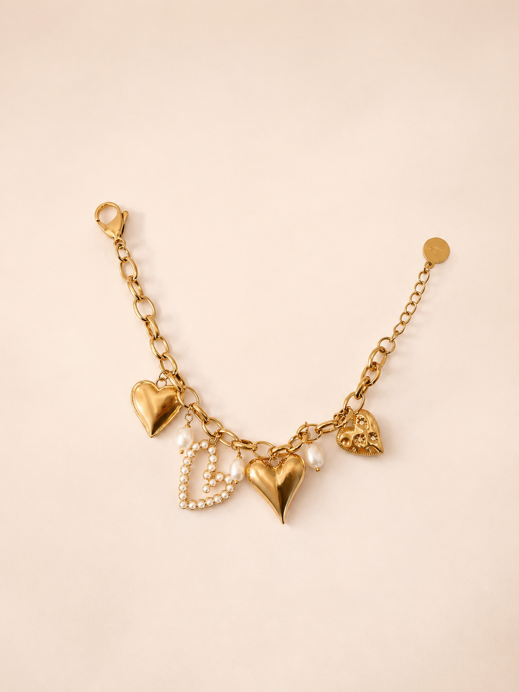 Armband met verschillende hartjes goud
