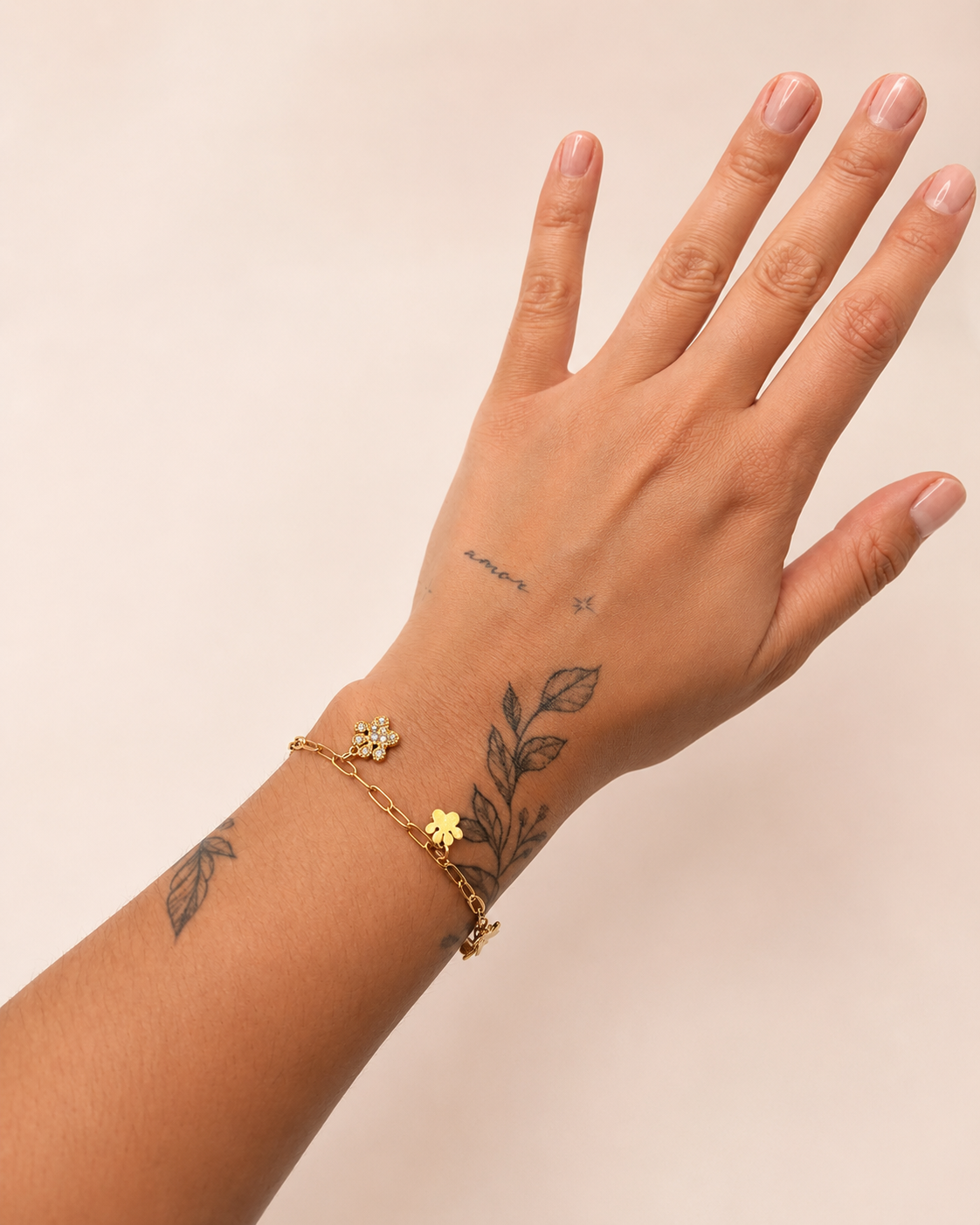 Armbandje hondenpootjes goud
