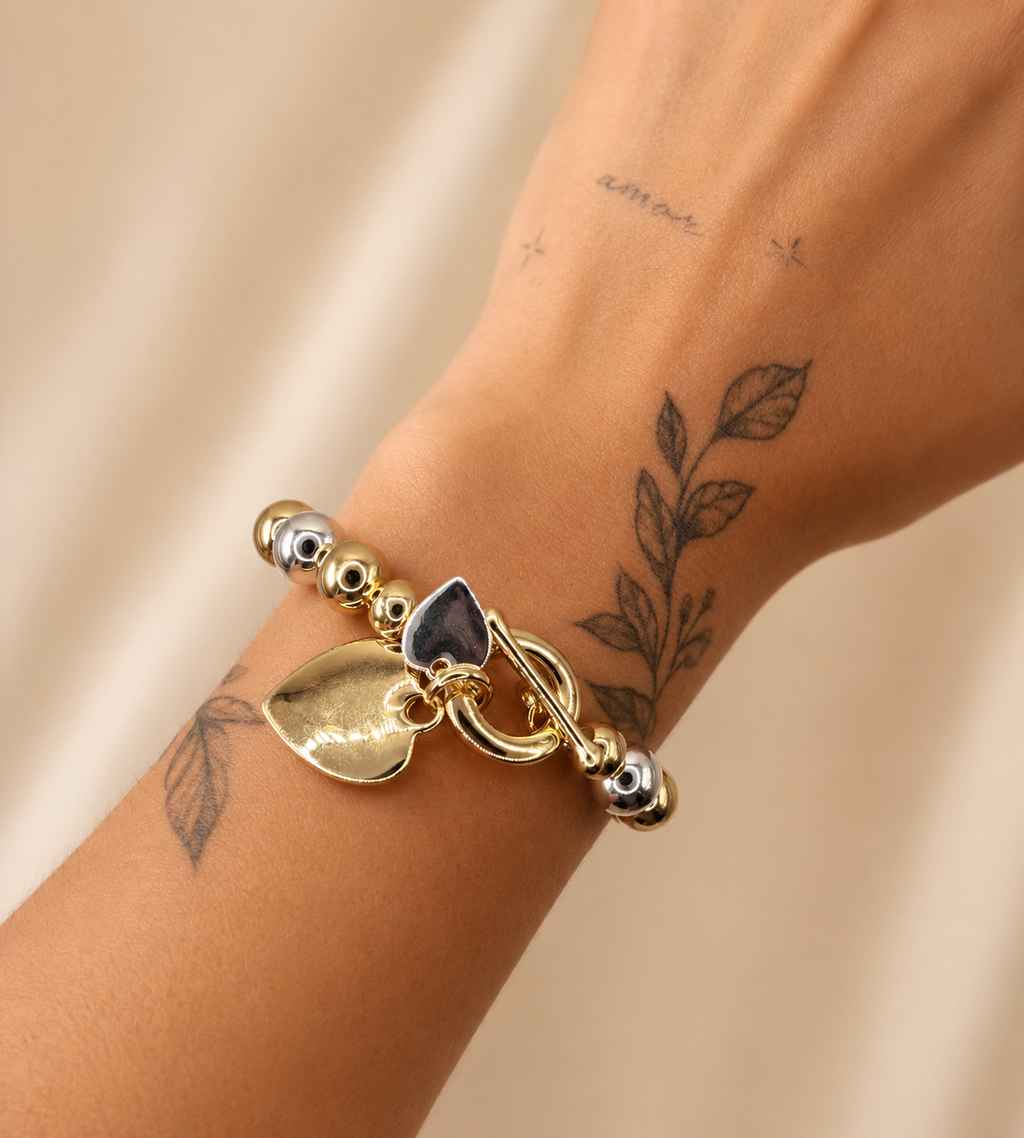 Elastische statement armband hart goud- en zilverkleurig