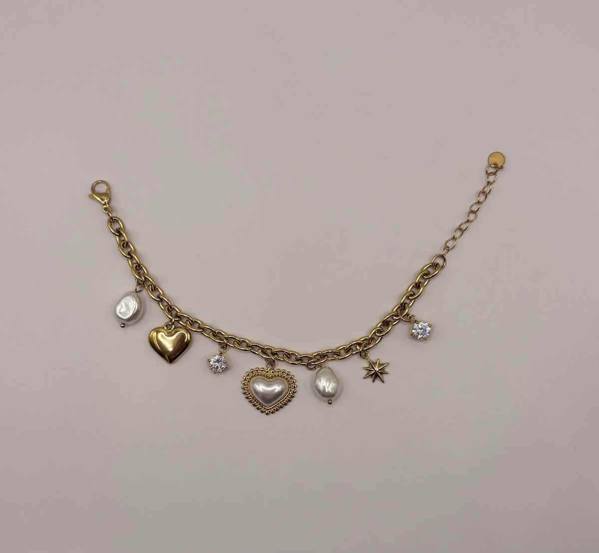 Schakelarmband met multi bedels goudkleurig