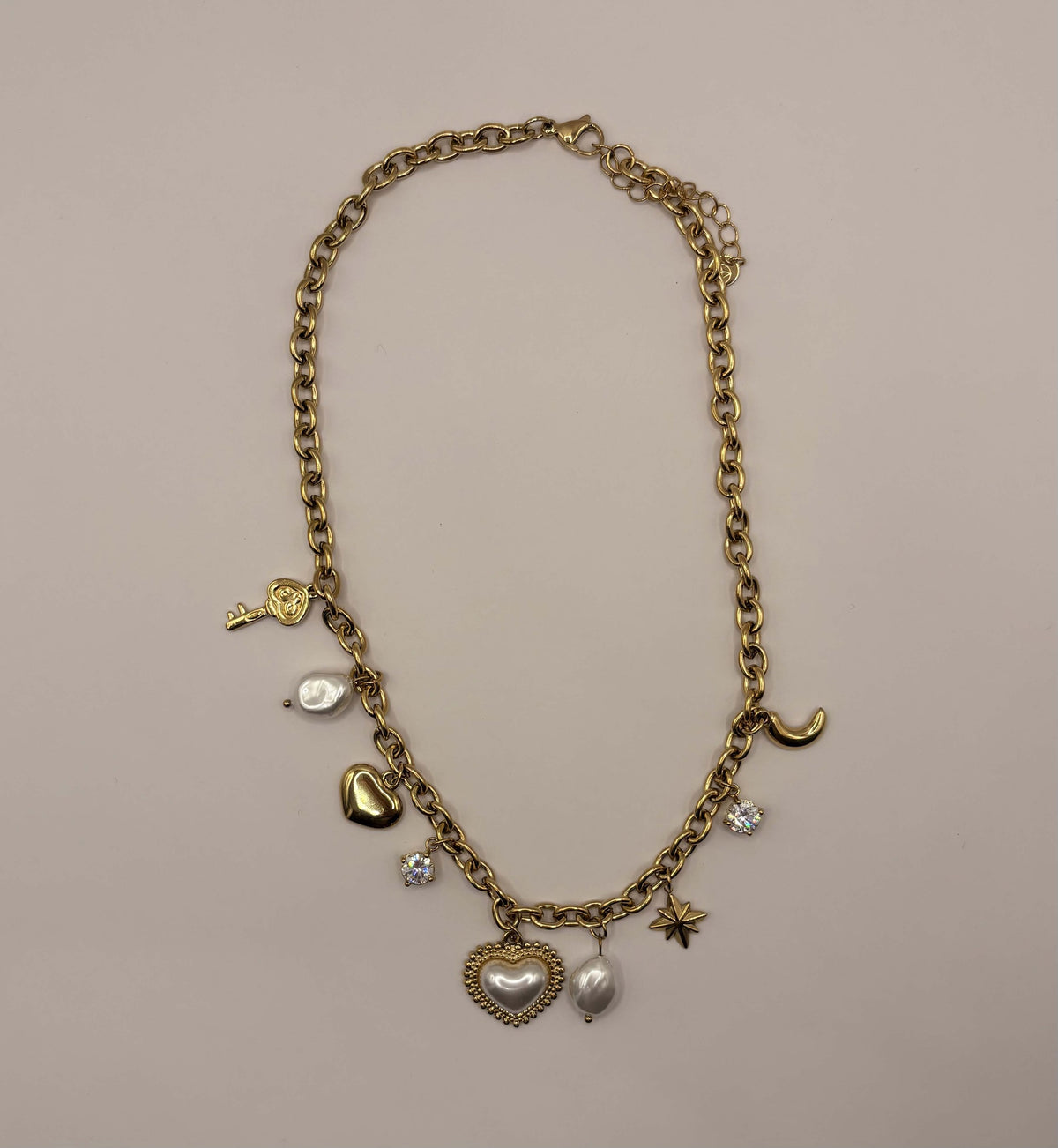 Schakelketting met multi bedels goudkleurig