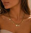 Schakelketting met multi bedels goudkleurig