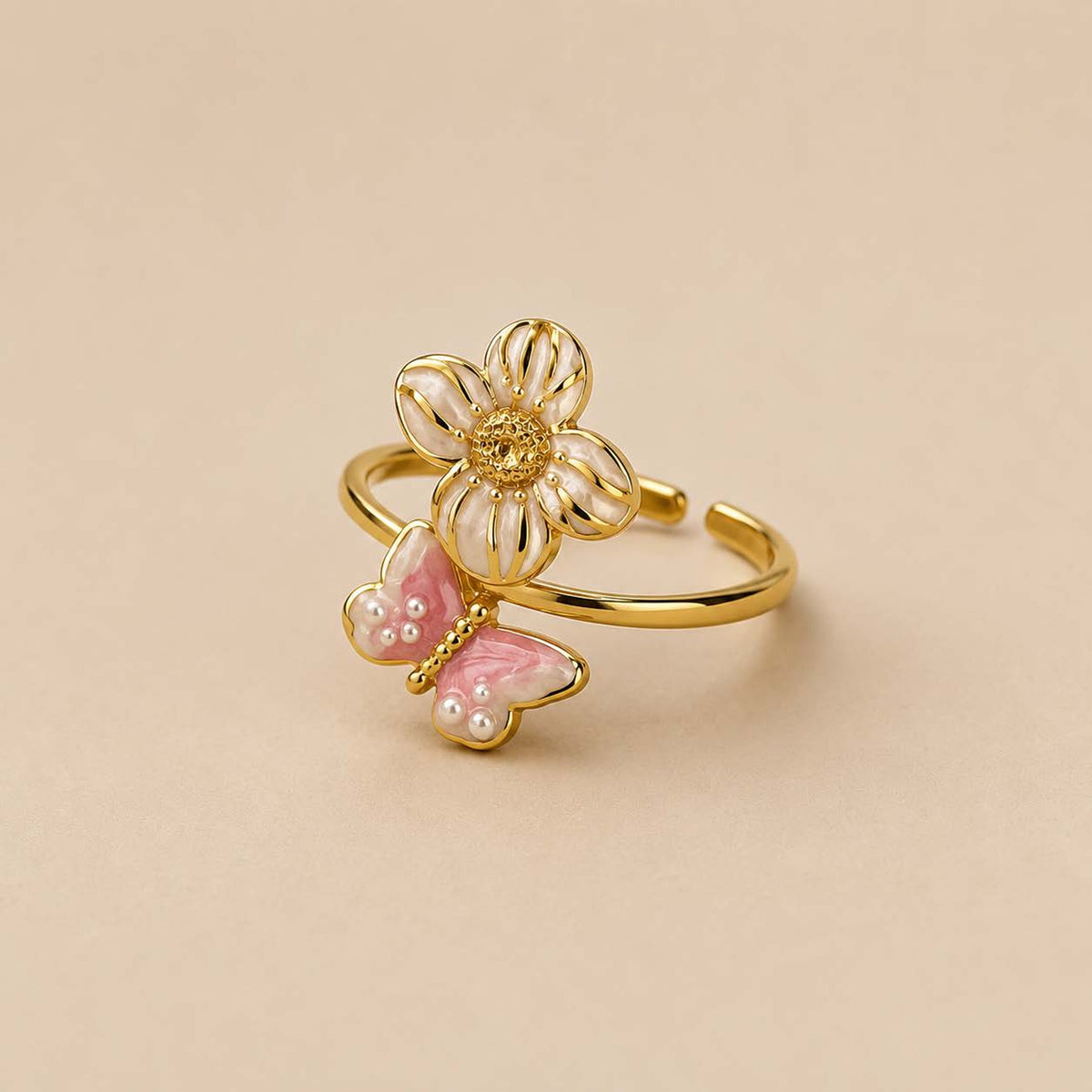 Ring met vlinder en bloem roze goud